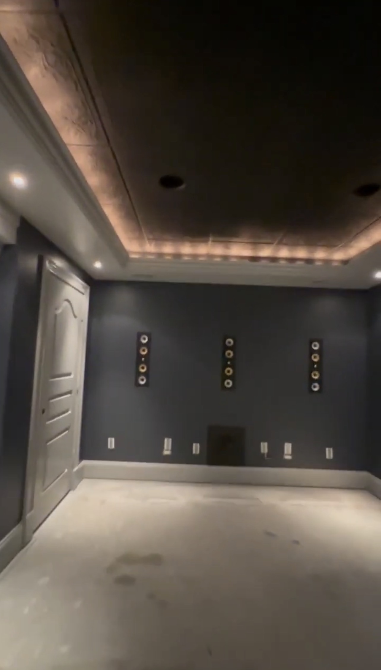 Finished basement living space with clean painted walls and bright trim