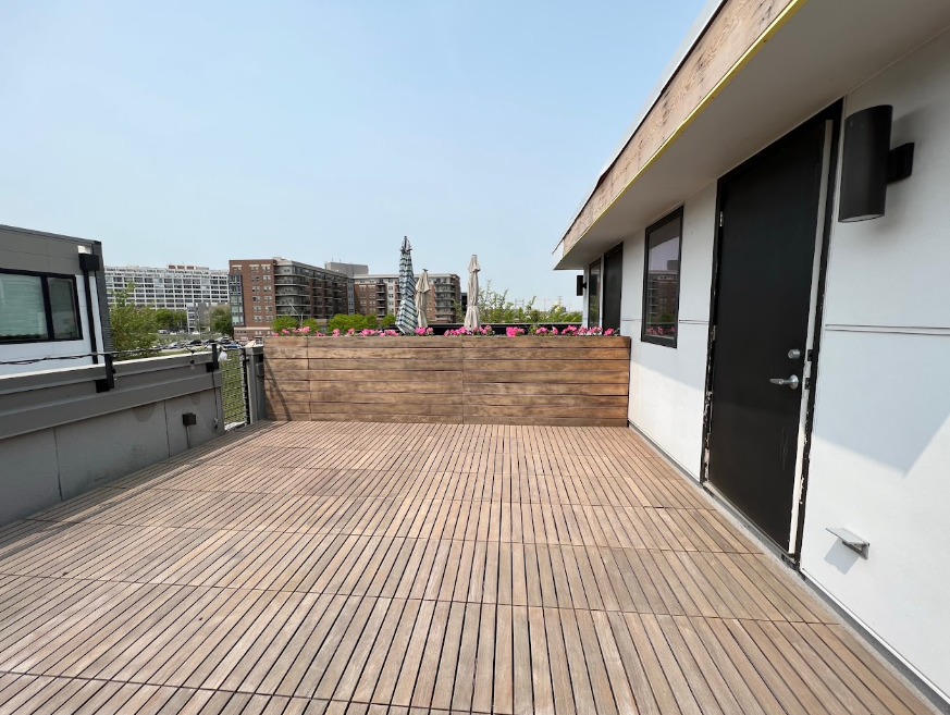 Weathered grey wooden deck before restoration staining