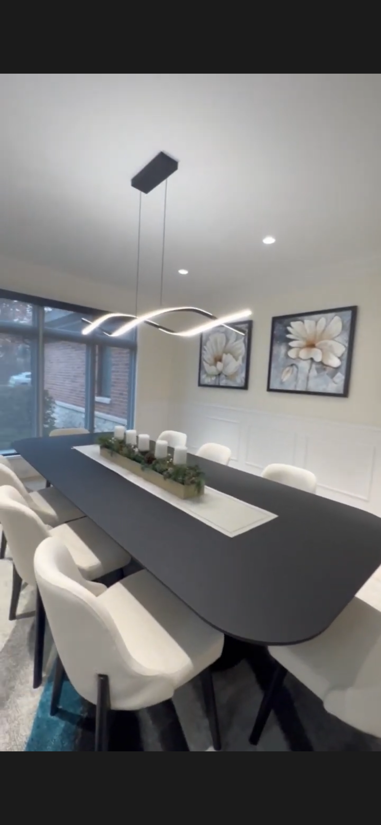 Dining room with painted upper walls and crisp white wainscoting
