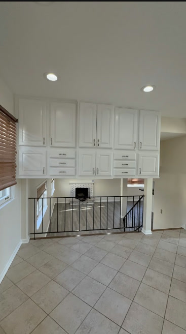 Modern white painted upper kitchen cabinets after refinishing