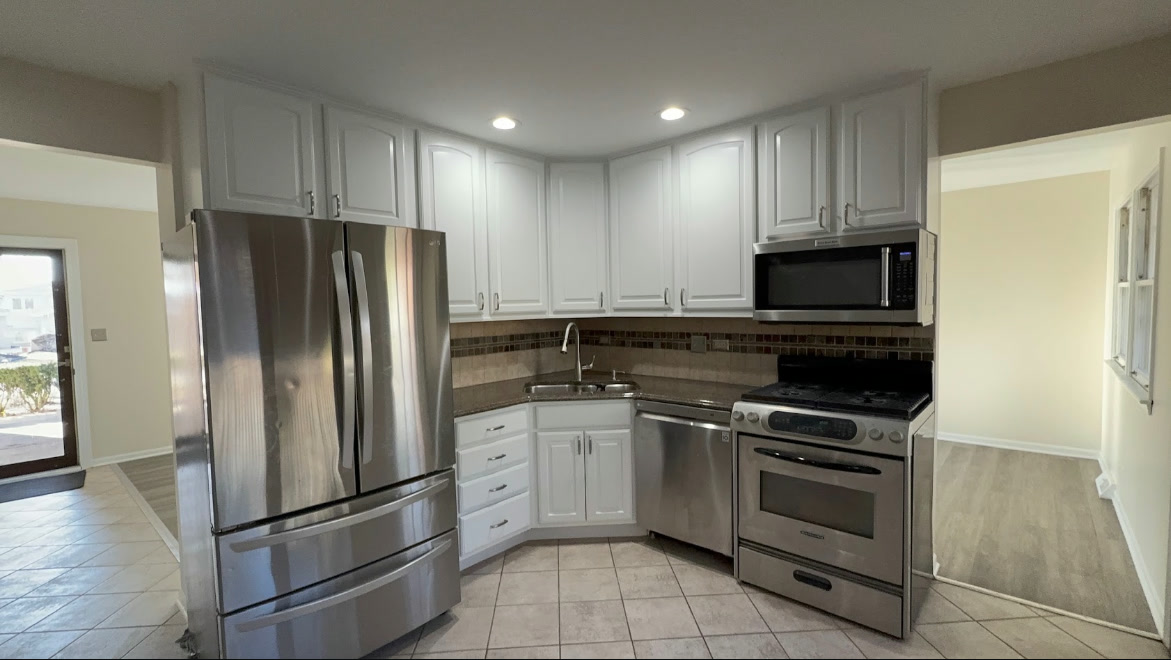DLC Painters professionally painted white kitchen cabinets after completion Chicago
